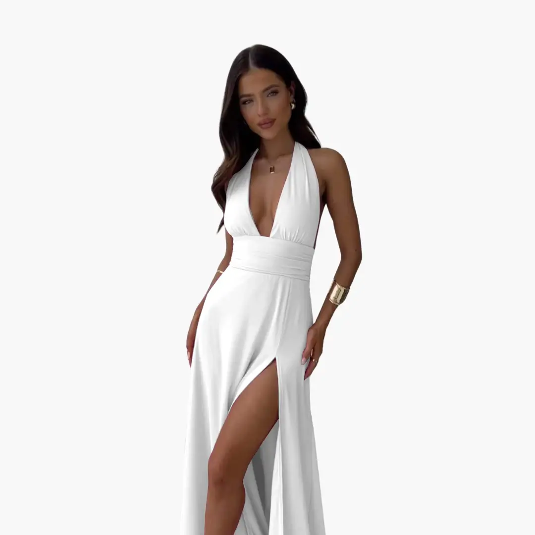 Maxi dress with halter neckline in white, featuring a wide waistband and thigh-high slit.