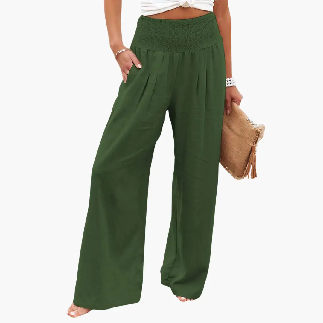 Palazzo trousers for women in green with wide legs, smocked waist, and front pleats.