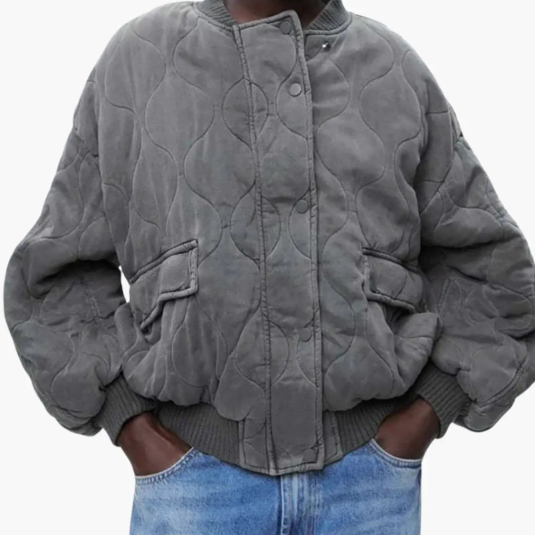 Loose-Fit Bomber Jacket for Women, quilted gray with oversized puff sleeves, front pockets and ribbed cuffs.