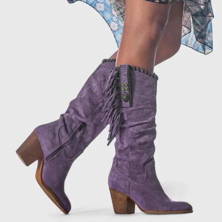Women's orthopedic boots in purple suede with fringe, side zipper, and wooden heel.