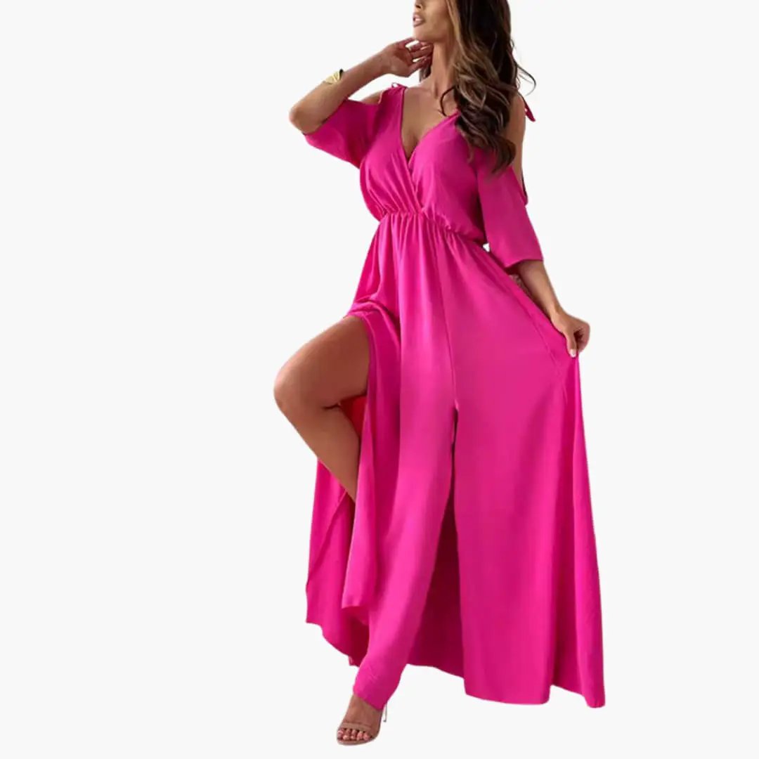 Pink maxi dress with V-neck, elastic waist, and high slit on a model.