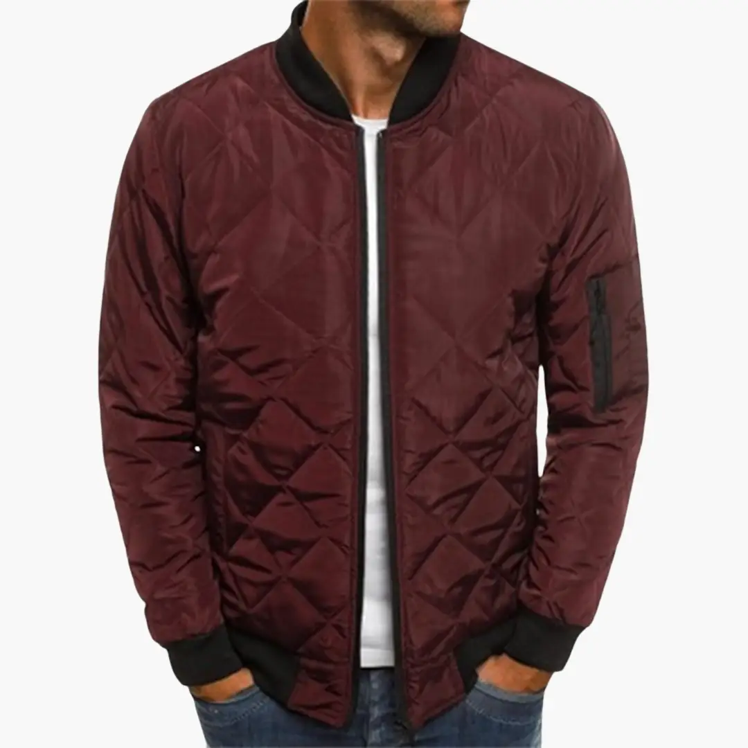 Men's burgundy quilted bomber jacket with zip-front, ribbed cuffs and hem, and a zip arm pocket.