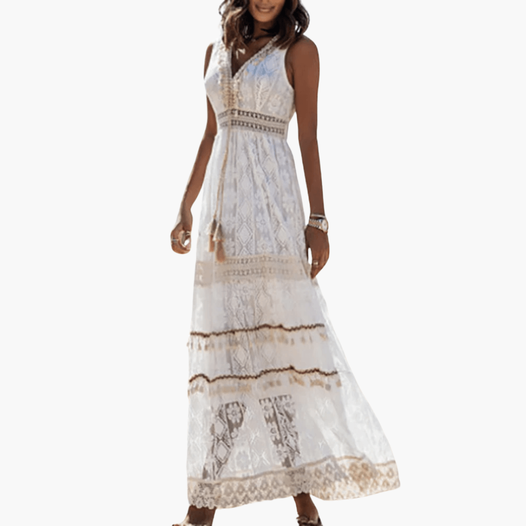 Maxi lace dress in airy boho style, white sleeveless gown with tassel belt and tiered hem