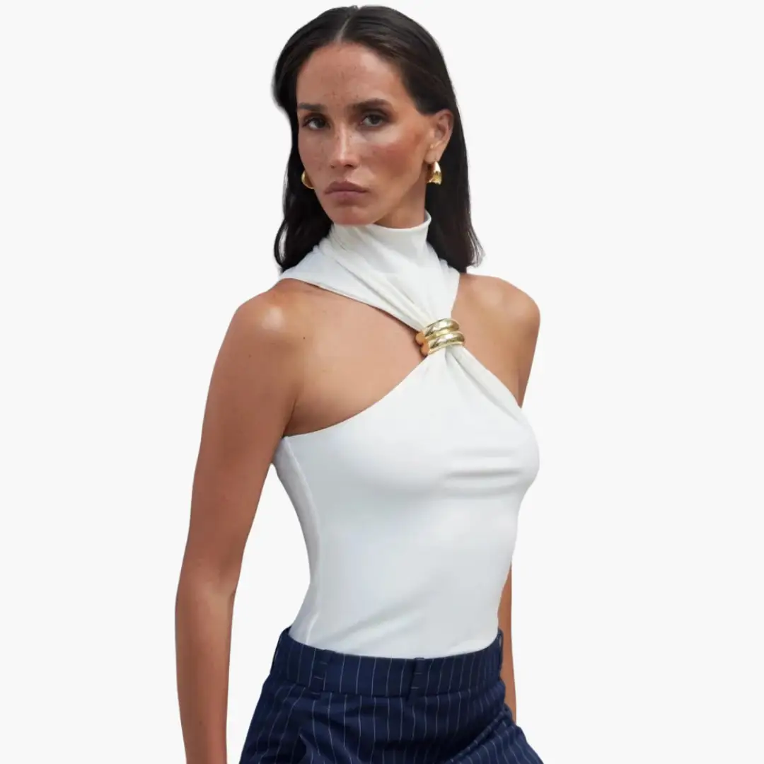 Chic high-neck halter top, white fabric with gold accent ring at the knot