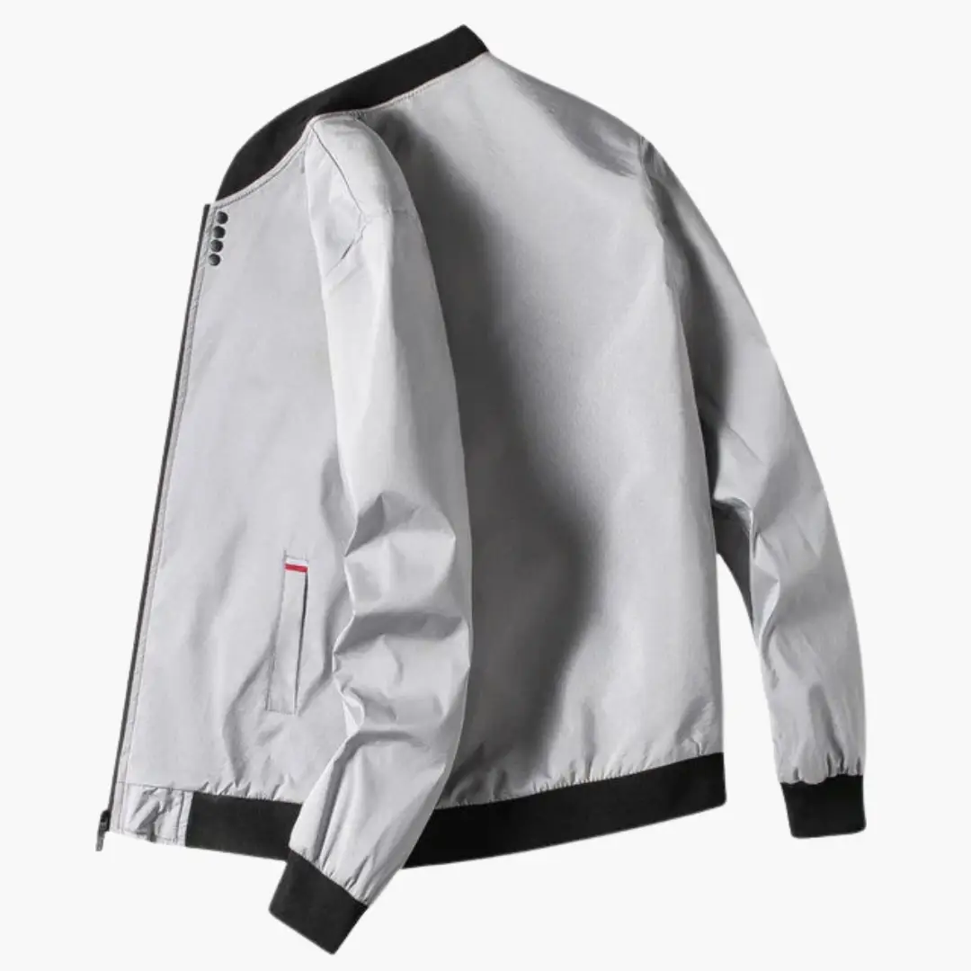 Men's bomber jacket by Wilfred Smith in metallic silver with ribbed black collar and cuffs, zip-front.