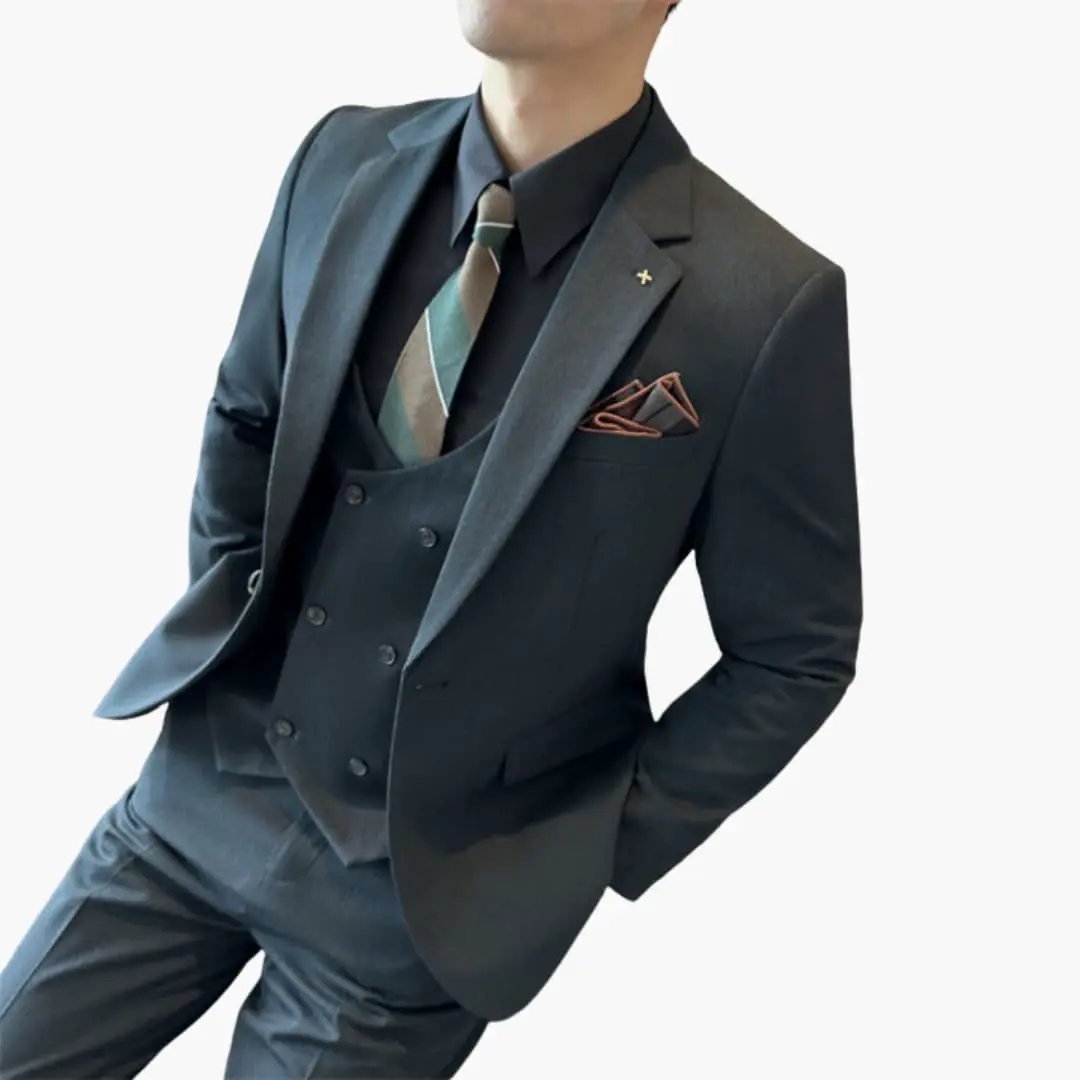 Three-piece Wilfred Smith men's suit in dark navy with notch lapels, waistcoat, and pocket square.