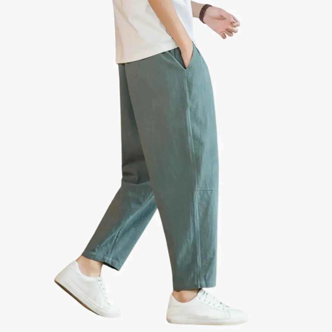 Comfortable men's leisure pants in teal with pockets, side view