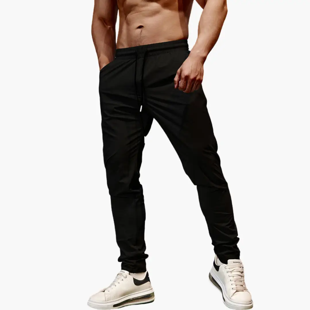 Men's jogging pants by Wilfred Smith with elastic waistband and drawstring, black joggers.
