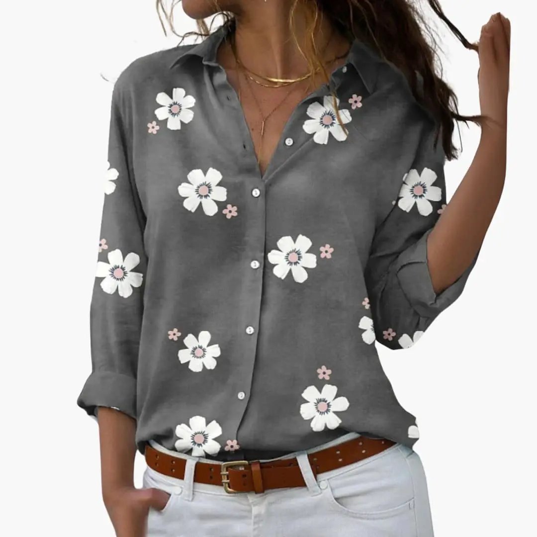 Floral blouse by Wilfred Smith, gray fabric with white daisy pattern and pink centers; button-down long sleeves.