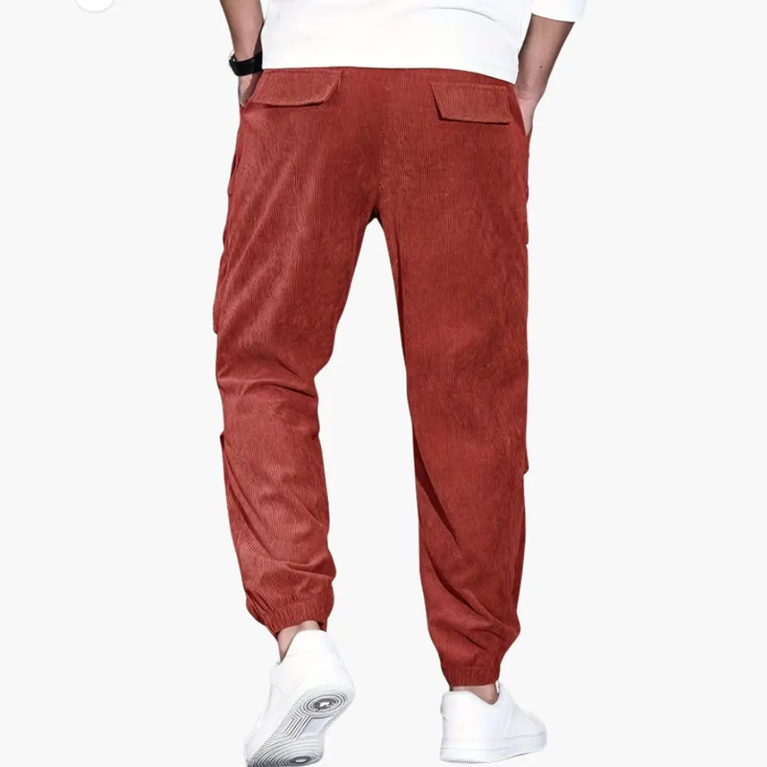 Men's rust-red corduroy trousers with waistband, side pockets and elastic cuffs