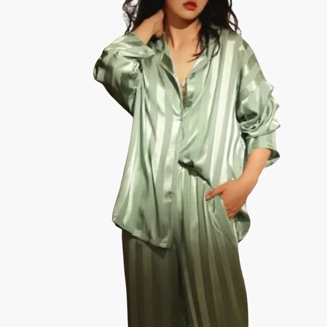 Women's satin pajama set with long-sleeve shirt and striped green pants, Wilfred Smith.