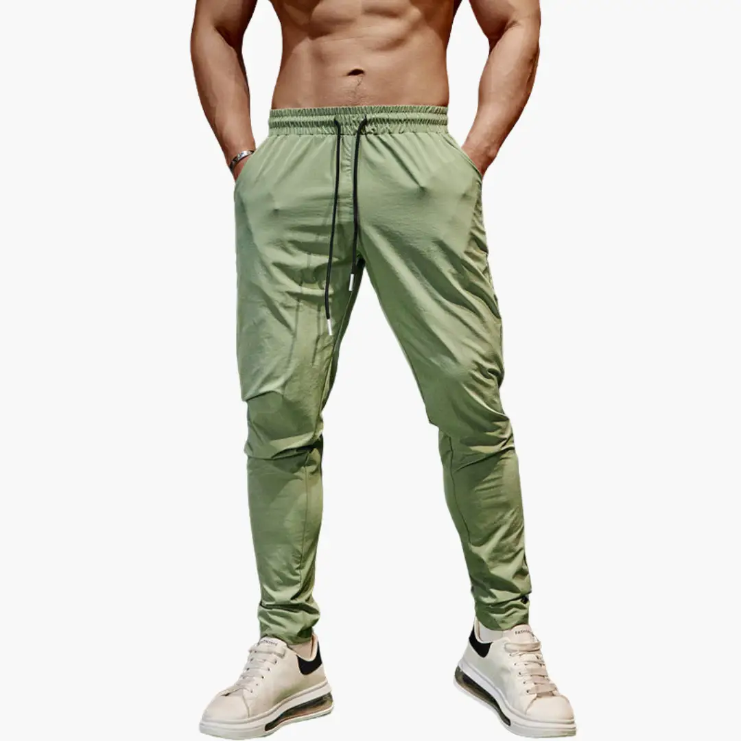 Men's olive green jogging pants with elastic waistband and drawstring