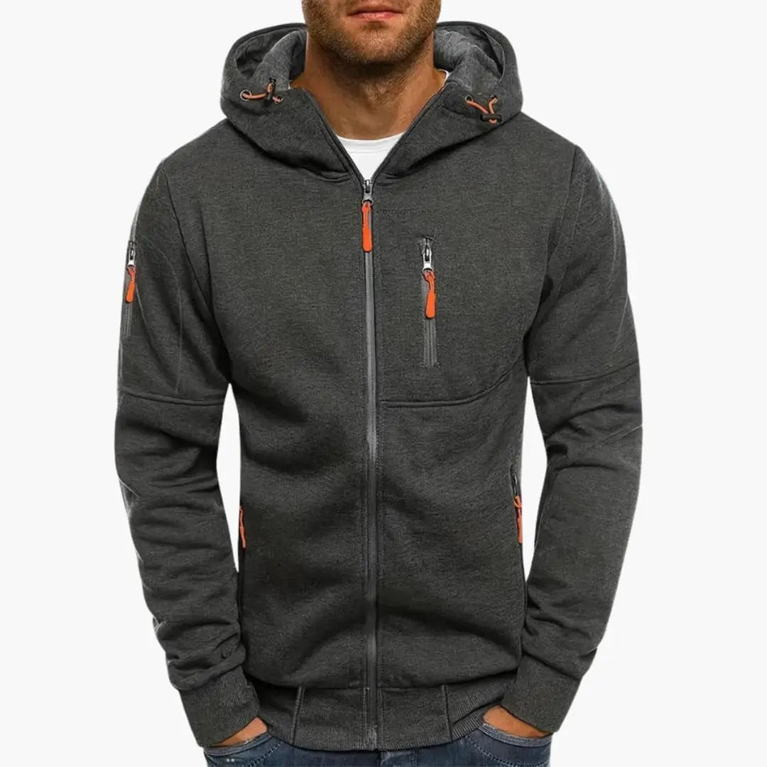 Men’s hooded track jacket by Wilfred Smith, charcoal gray with orange zipper pulls and zip pockets