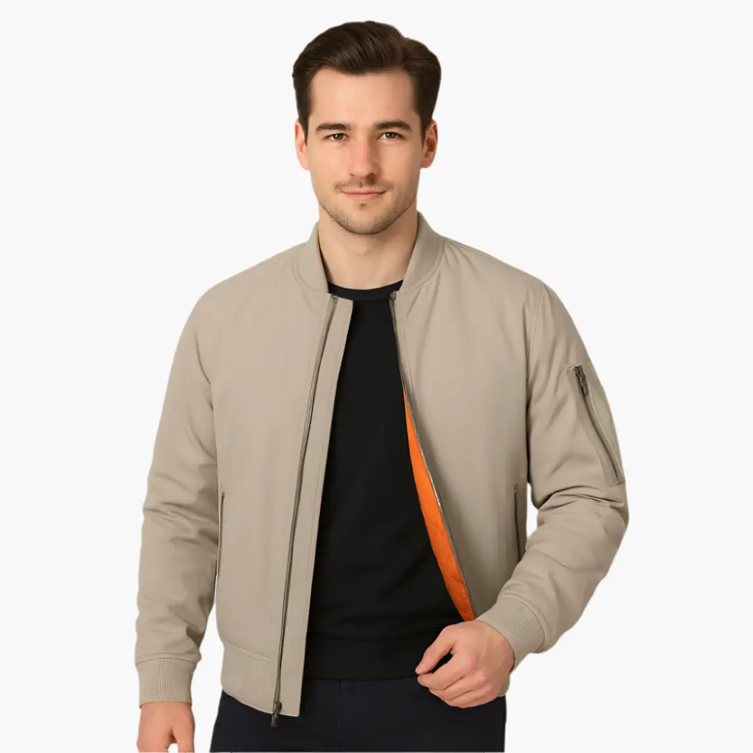 Men's beige bomber jacket with orange lining, front zipper, ribbed cuffs.
