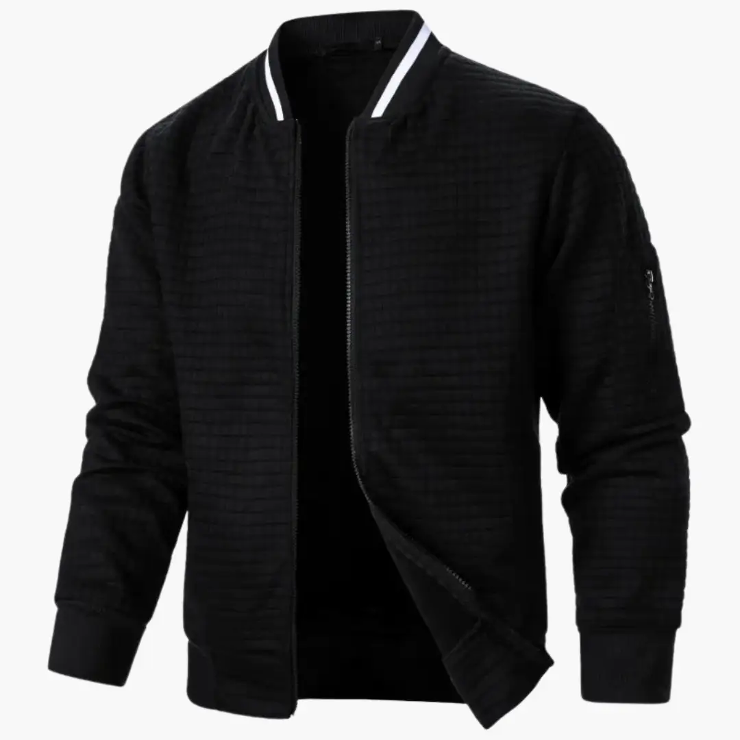 Bomber jacket by Wilfred Smith in black, quilted texture with white striped collar.