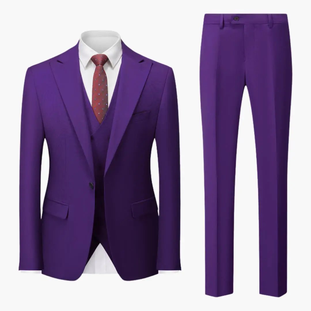 Purple men's three-piece suit with blazer, waistcoat and trousers, white shirt and red tie.
