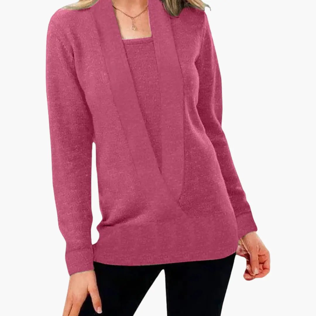 Women's pink knit sweater by Wilfred Smith with deep V-neck and long sleeves.