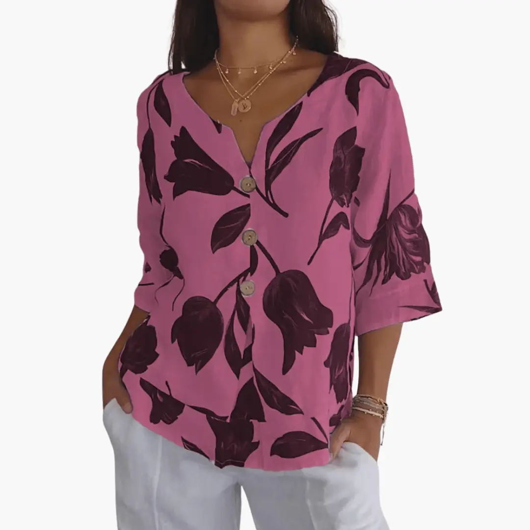 Women's pink floral print blouse with dark purple leaves, V-neck, button-front, 3/4 sleeves.
