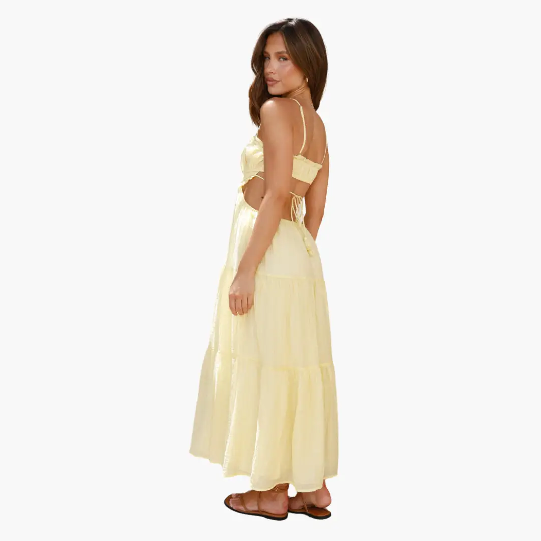 Maxi dress for women in pale yellow Boho style with tie-back straps and a tiered, ankle-length skirt