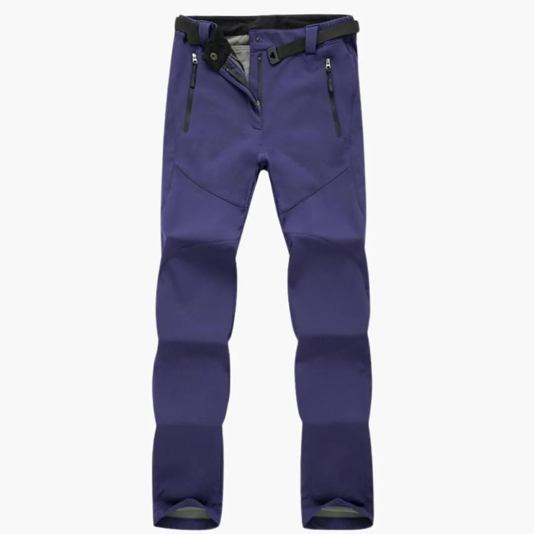 Women's hiking pants with zip pockets in purple, featuring a belt and belt loops.
