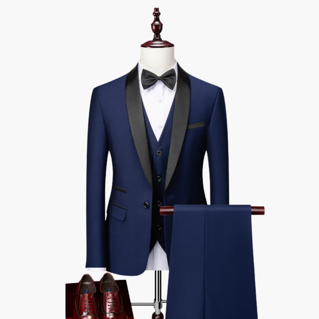 Men's navy three-piece suit with black satin shawl collar and waistcoat, white shirt and bow tie; trousers on hanger