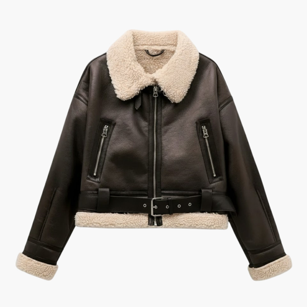 Women's zip bomber jacket in black leather with cream shearling collar, cuffs, and hem; belted waist.