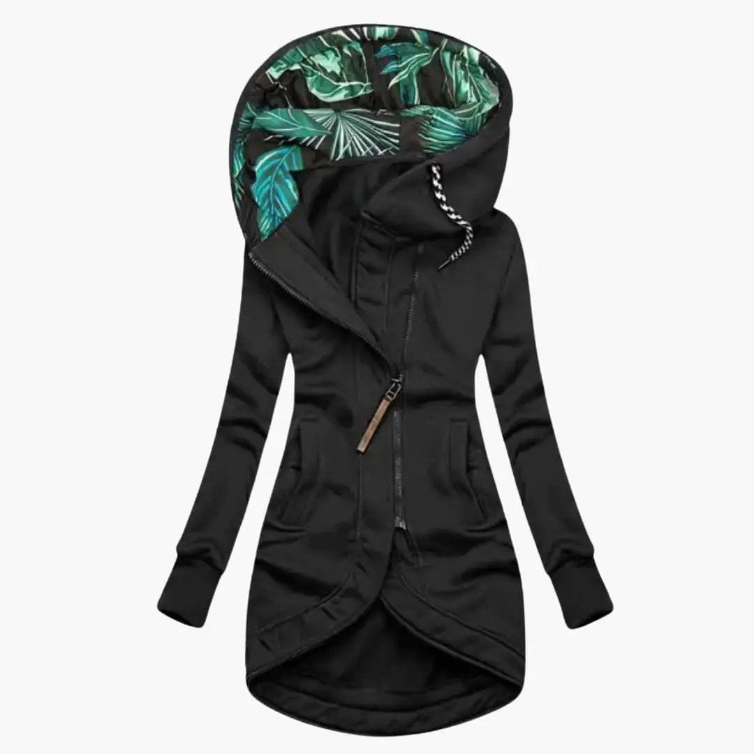 Women's black hooded jacket with an asymmetrical zipper, front pockets, and a tropical leaf-lined hood.