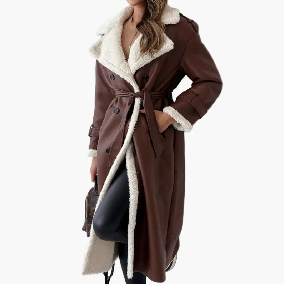 Women's long brown coat with notched shearling collar, belted waist and faux fur lining.
