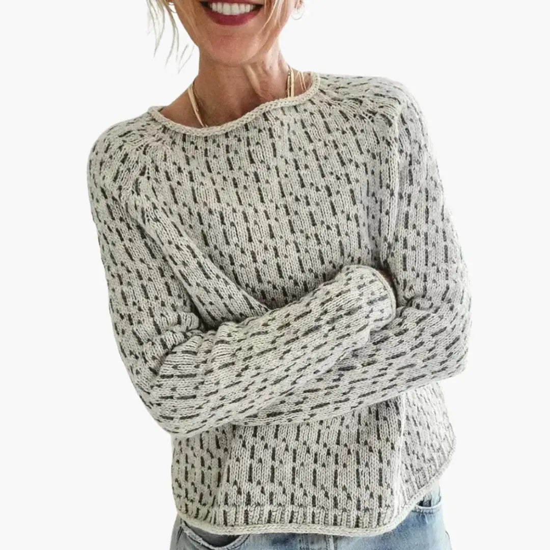 Women's round-neck knit sweater in cream with a black speckled pattern