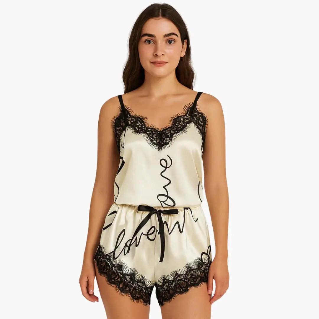 Women's satin pajama set with spaghetti top and printed cream shorts, black lace trim, 2-piece.