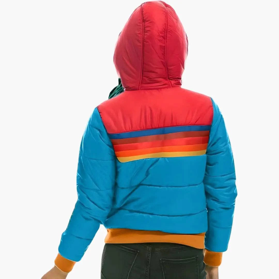 Women's padded jacket with hood, color-block blue body and red hood with rainbow stripe across back, zipper