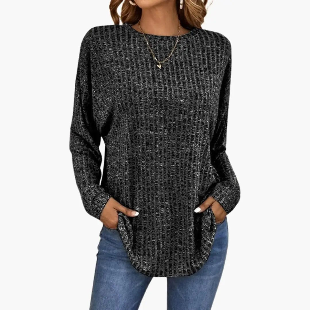 Women's knit sweater by Wilfred Smith in black with ribbed surface and round neckline