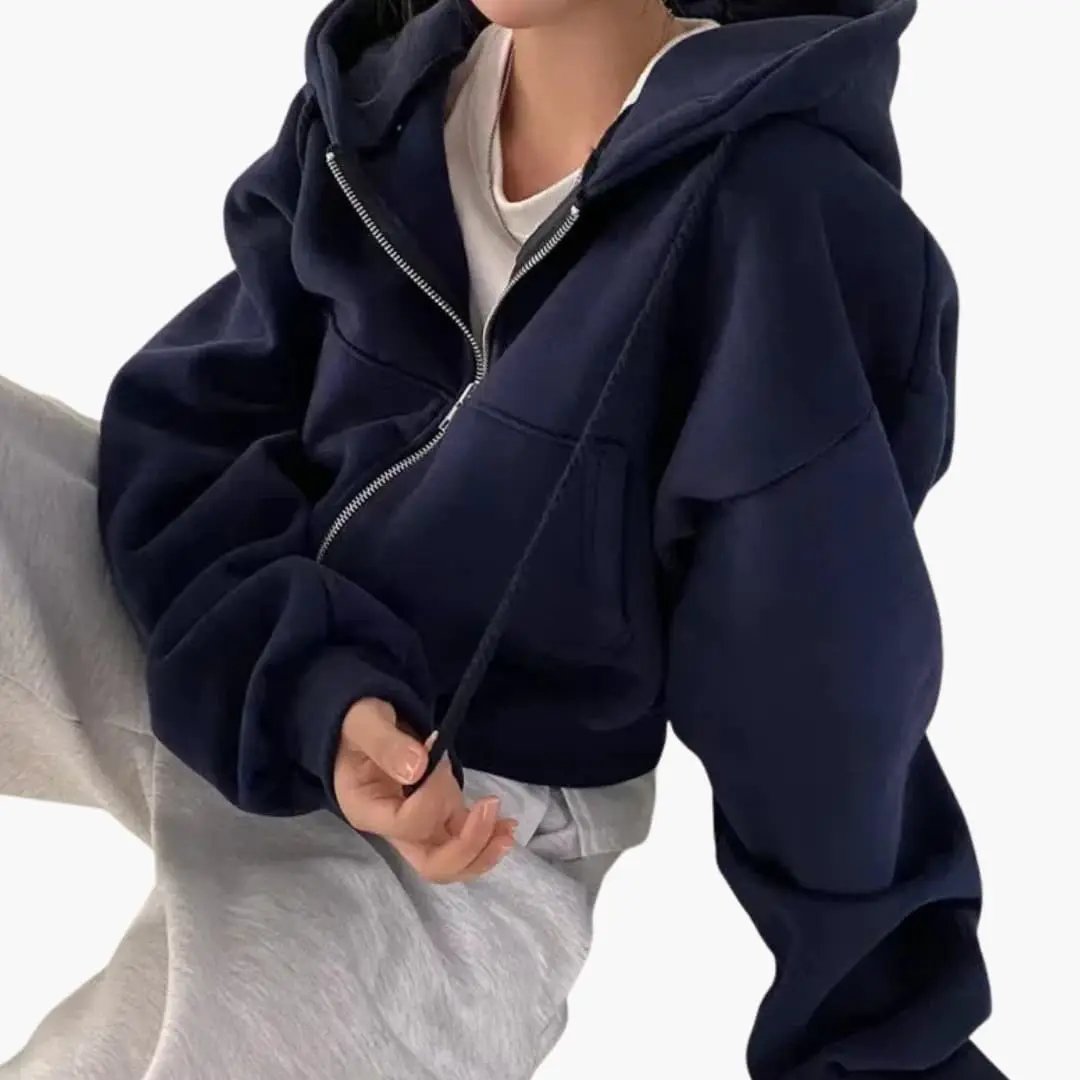 Women's cropped navy zip hoodie sweatshirt with oversized sleeves and silver front zipper