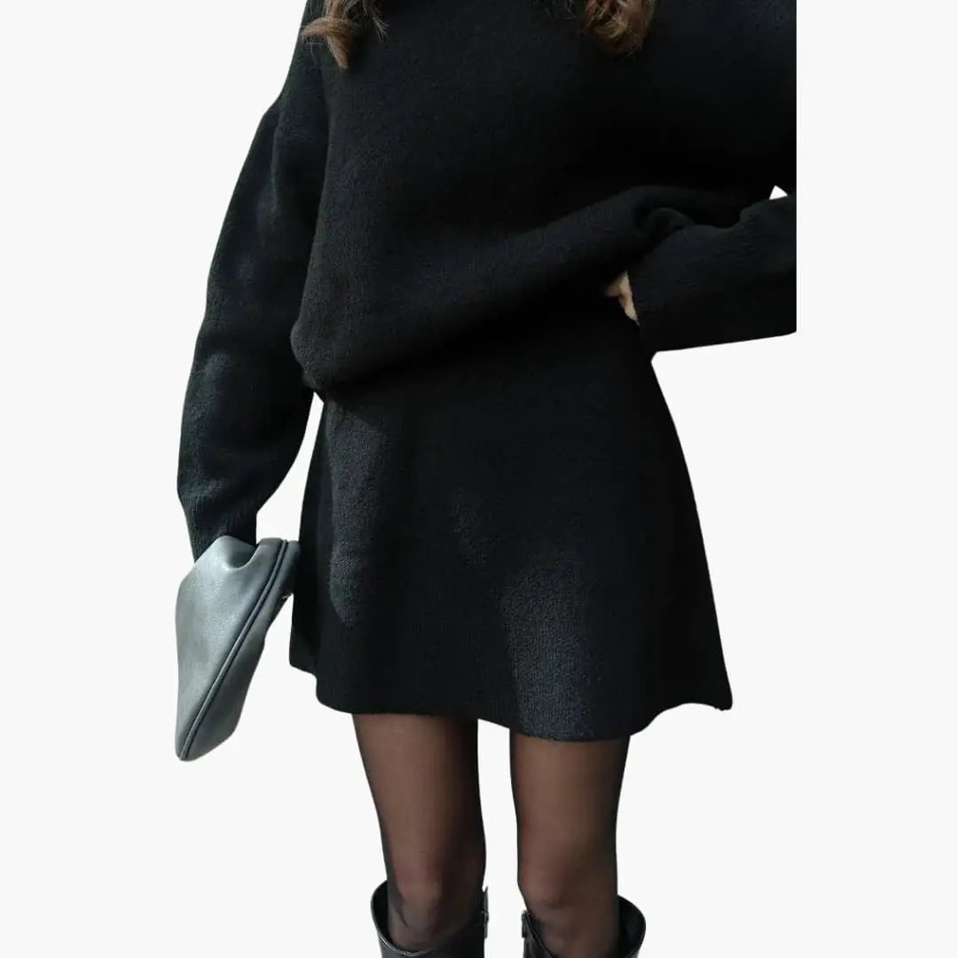 Women's two-piece knit set with round-neck black sweater and matching skirt