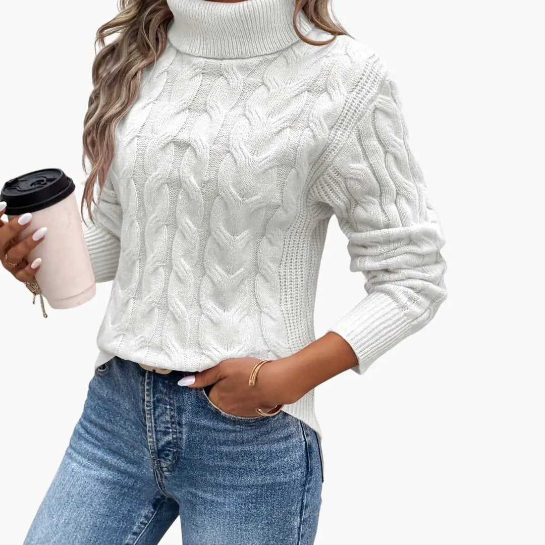 Women's white cable-knit turtleneck sweater pullover featuring a chunky knit pattern.