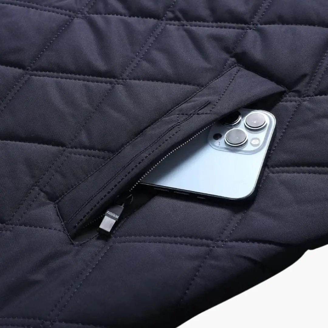 Men's quilted navy jacket with lapel collar; front zip pocket holding phone.