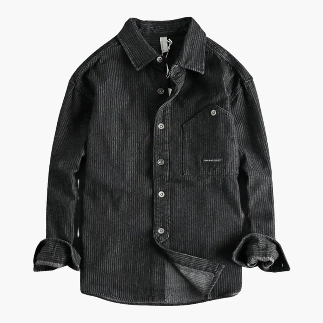 Men's utility shirt by Wilfred Smith in dark gray corduroy with chest pocket and snap button closure.