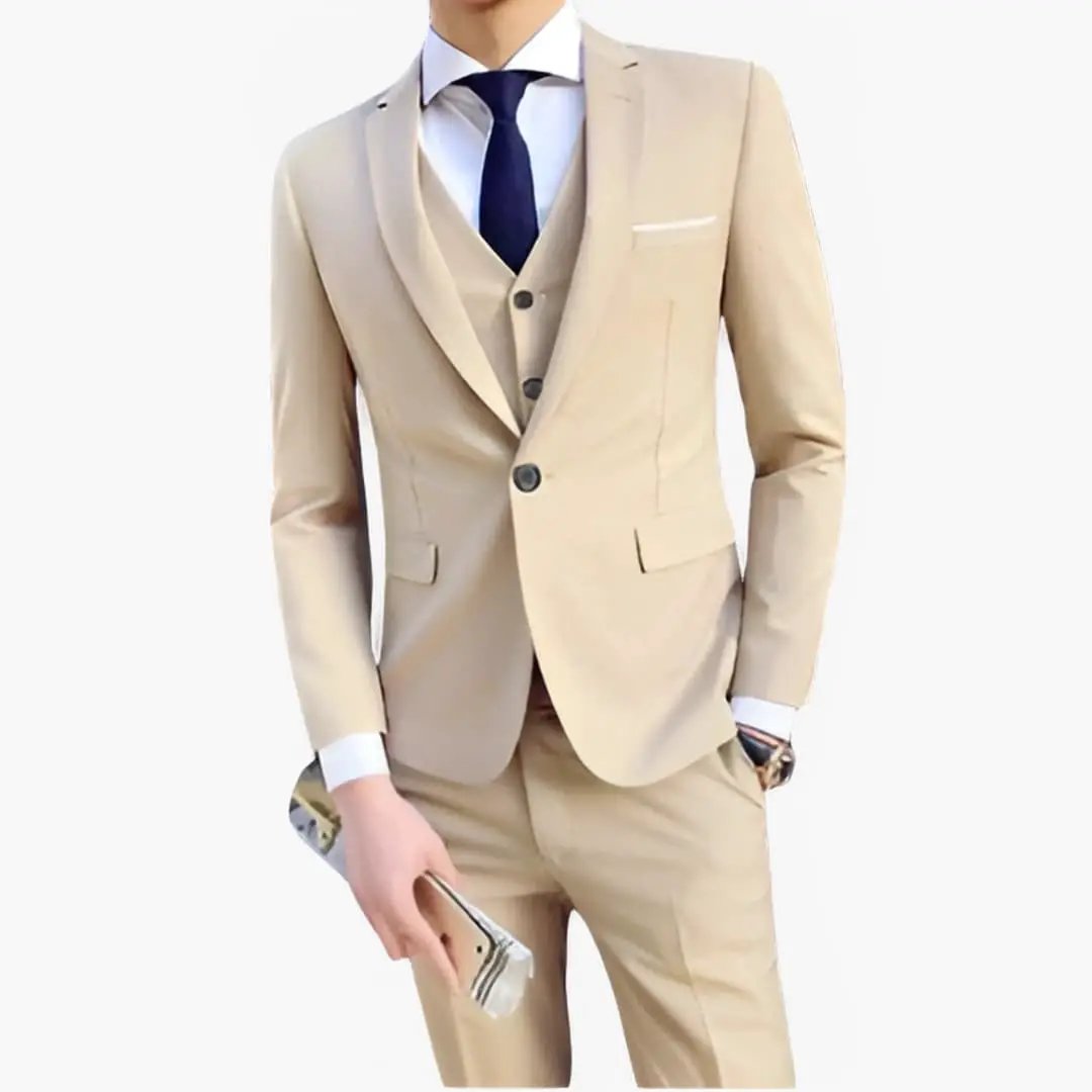 Men's wedding suit set in beige with jacket and vest by Wilfred Smith, white shirt and navy tie.