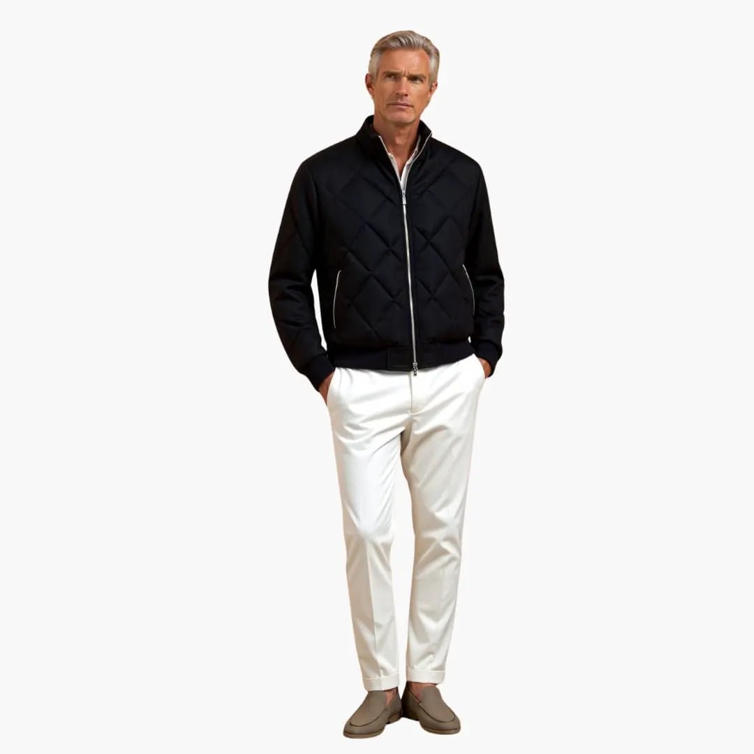 Men's quilted jacket with zipper, black, shown on a man wearing white pants