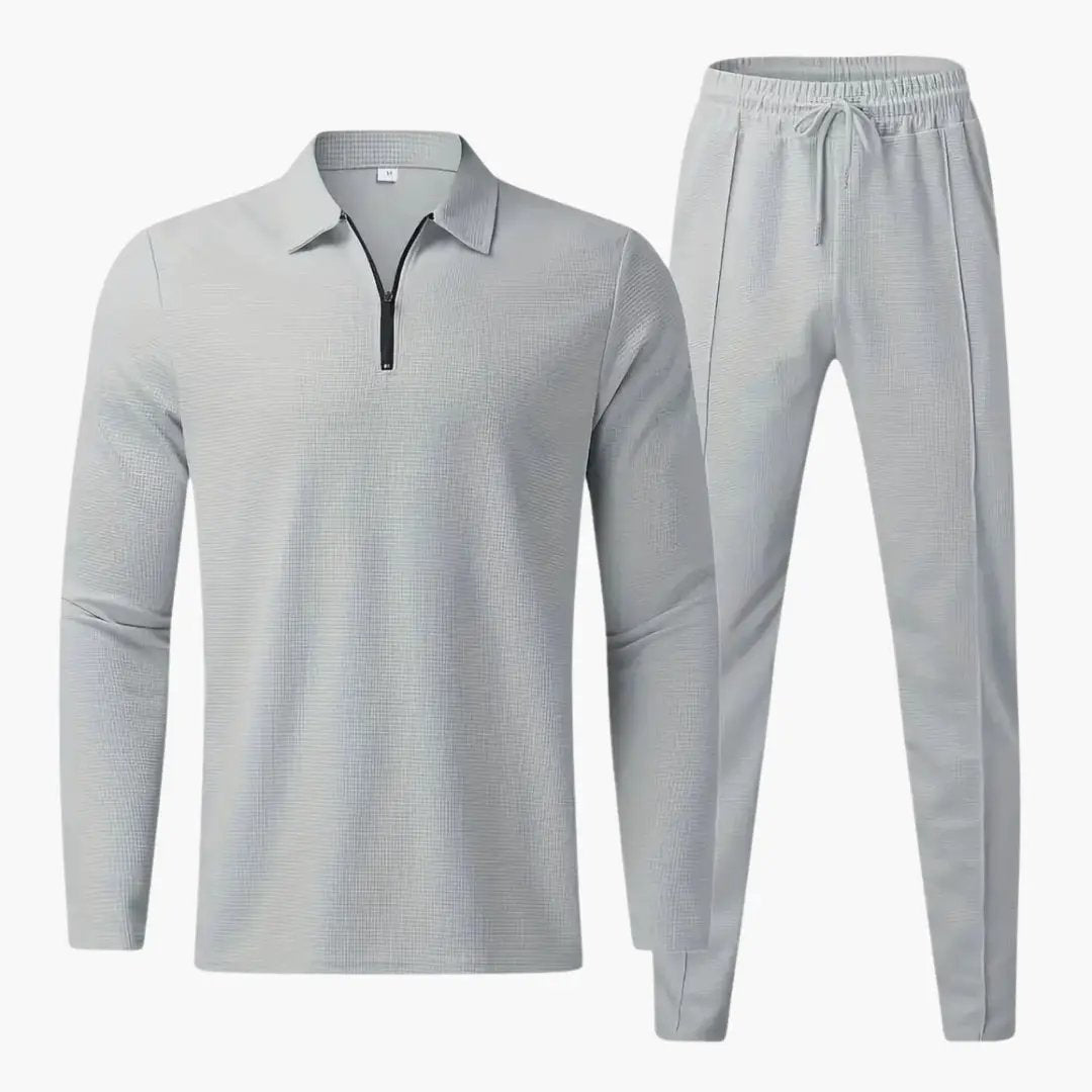Two-piece men's tracksuit set with quarter-zip top and tapered pants in light gray by Wilfred Smith