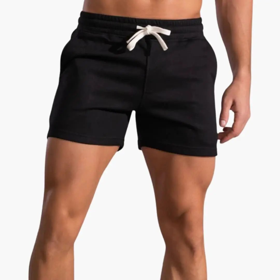 Men's above-knee shorts in black with elastic waistband and white drawstring by Wilfred Smith