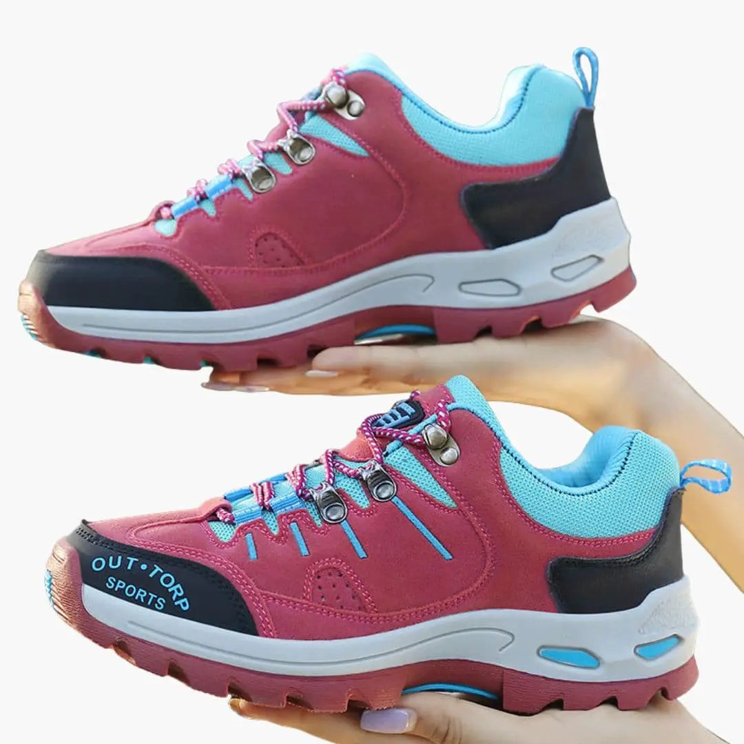 Pair of Men’s hiking shoes by Outtorp Sports in pink with blue accents and textured outsole