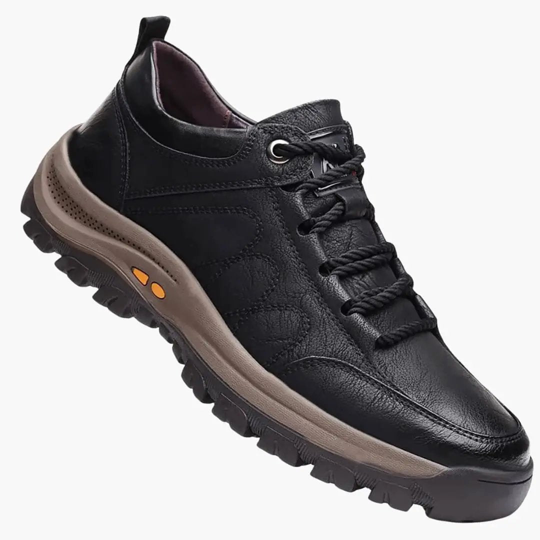 Men's orthopedic athletic shoe by Wilfred Smith with black leather upper and tan cushioned sole