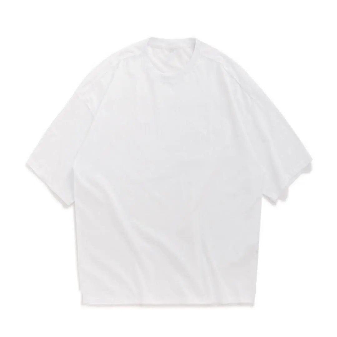 Men’s oversized white T-shirt by Wilfred Smith with crew neck and short sleeves.