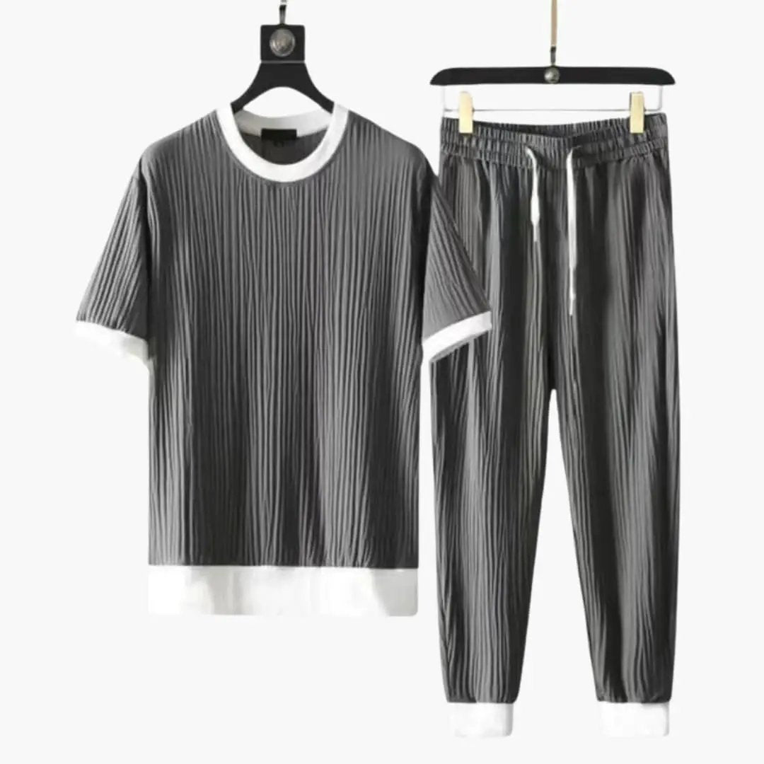 Men's pleated two-piece jogger set: short-sleeve tee and drawstring pants in gray/black vertical stripes with white trim
