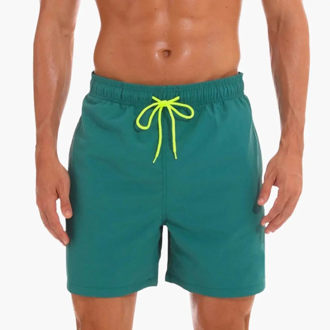 Men's jogger shorts by Wilfred Smith in teal with neon yellow drawstring and elastic waistband.