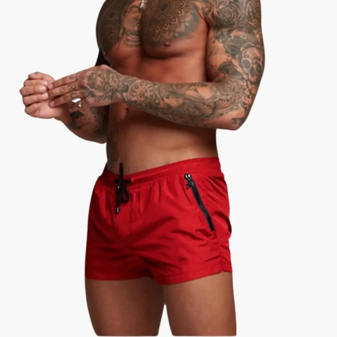 Men’s Shorts by Wilfred Smith, red jogger shorts with elastic waistband and zippered pockets