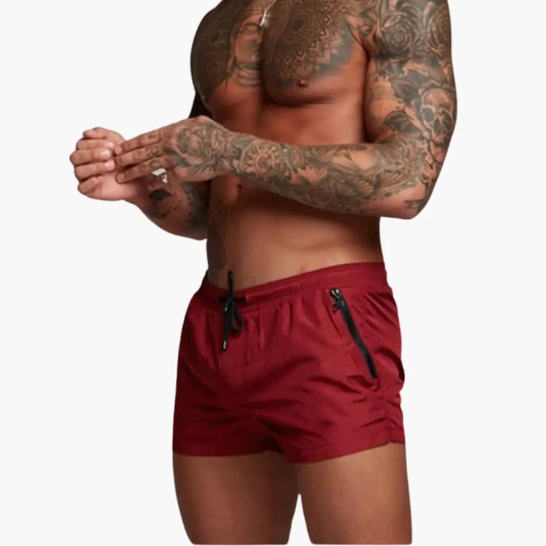 Men’s Shorts by Wilfred Smith: red jogger shorts with elastic waistband and zippered pockets