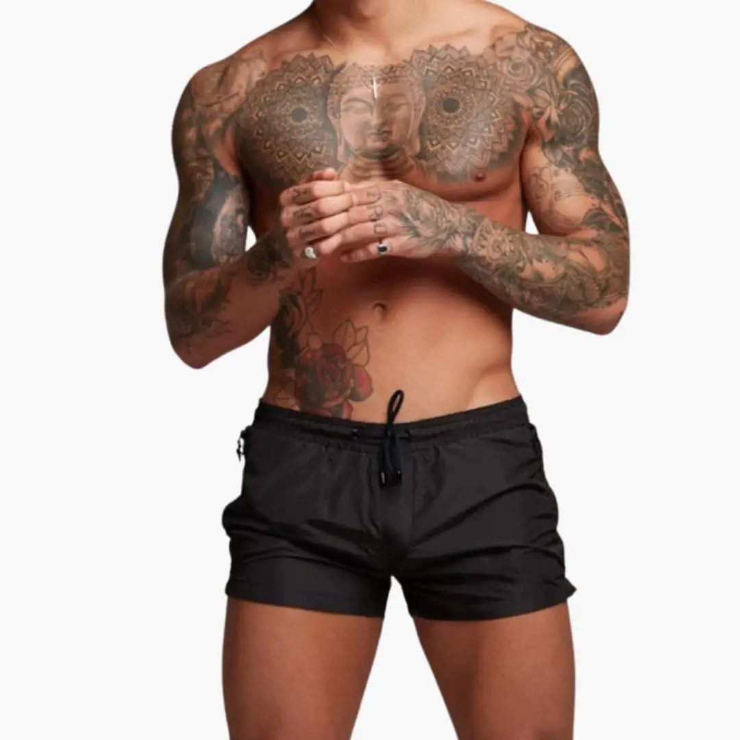 Men’s Jogger Shorts in black with elastic waistband, drawstring, and zippered pockets