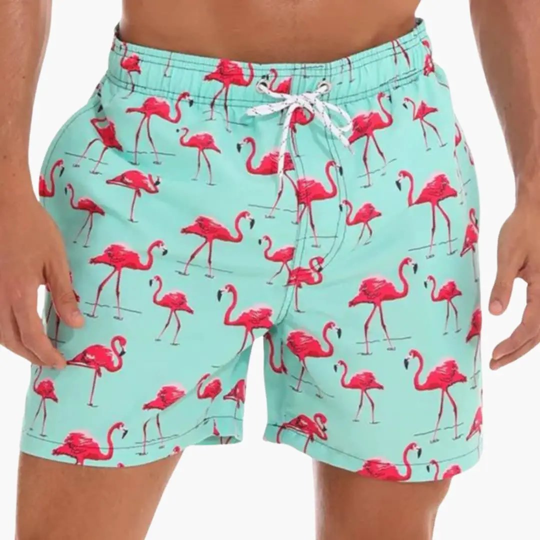 Men’s Swim Shorts with pink flamingo print on turquoise, elastic waistband, inner lining, water-resistant boardshorts